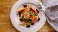 Herb-crusted lamb rack with red wine jus