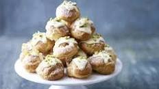 Raspberry, white chocolate & pistachio profiteroles